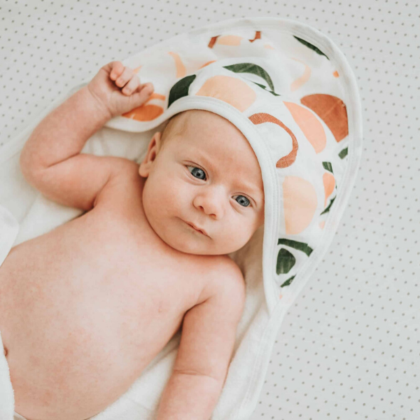 baby wearing bamboo hooded towel