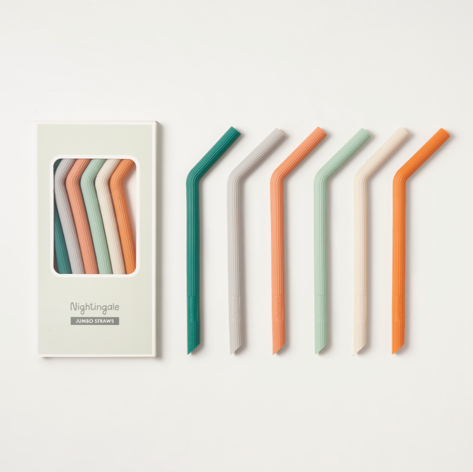 Set of colorful straws for smoothies and boba drinks with packaging on a white background